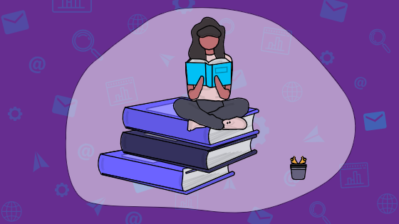Sitting on a pile of books, reading for read a book day